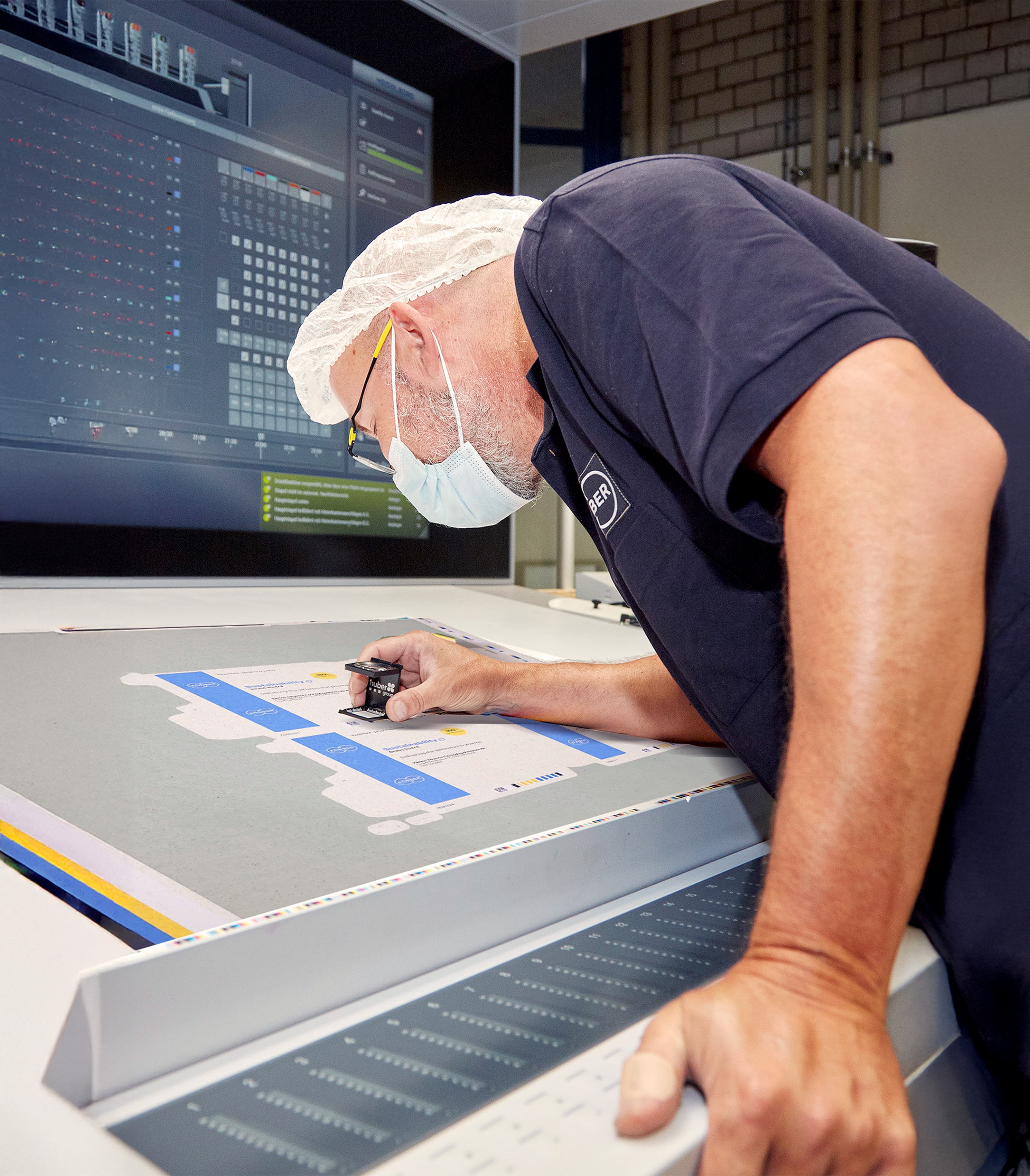 Man inspecting packaging materials for pharmaceuticals