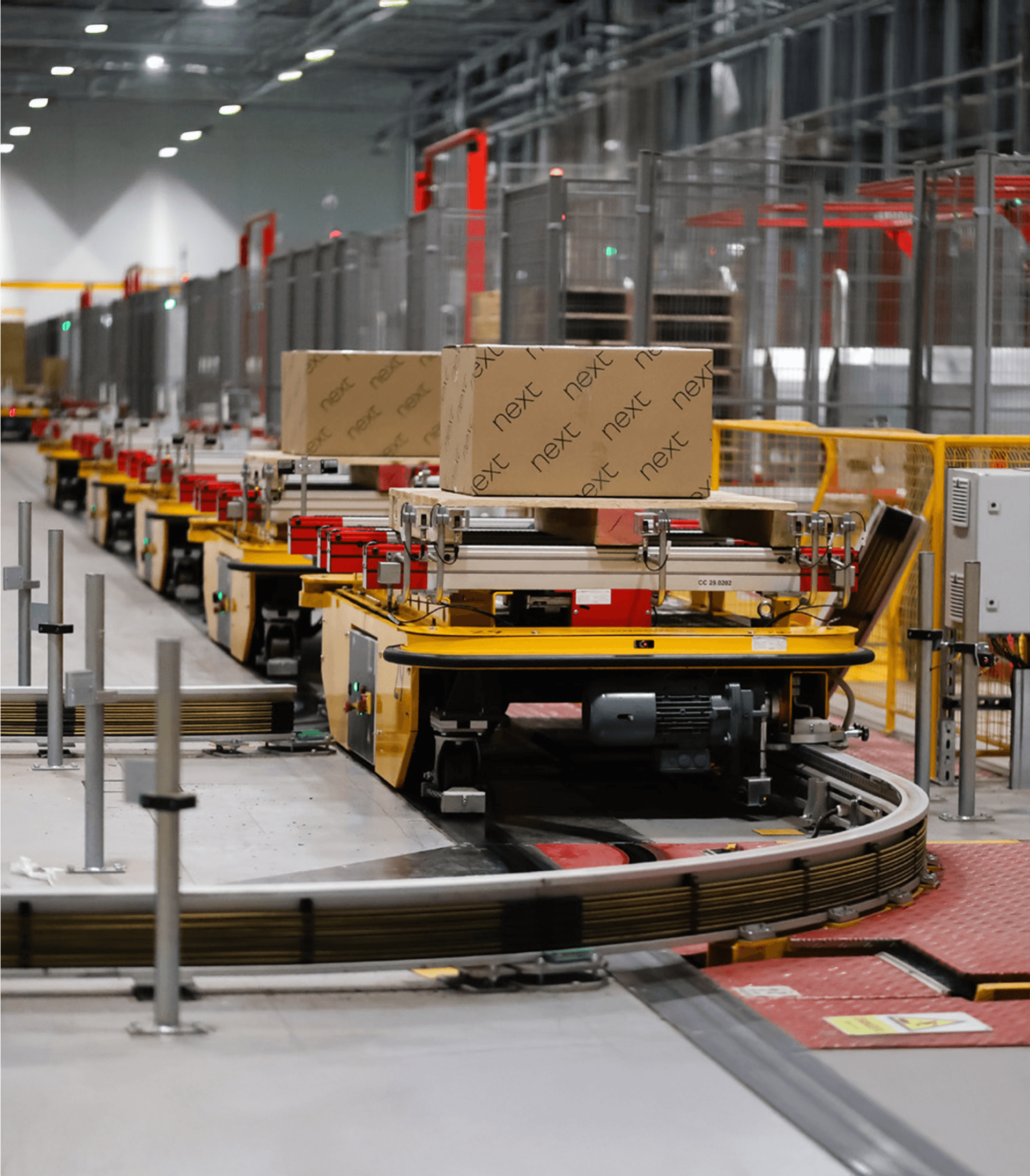 Packages from Next retailor in a warehouse