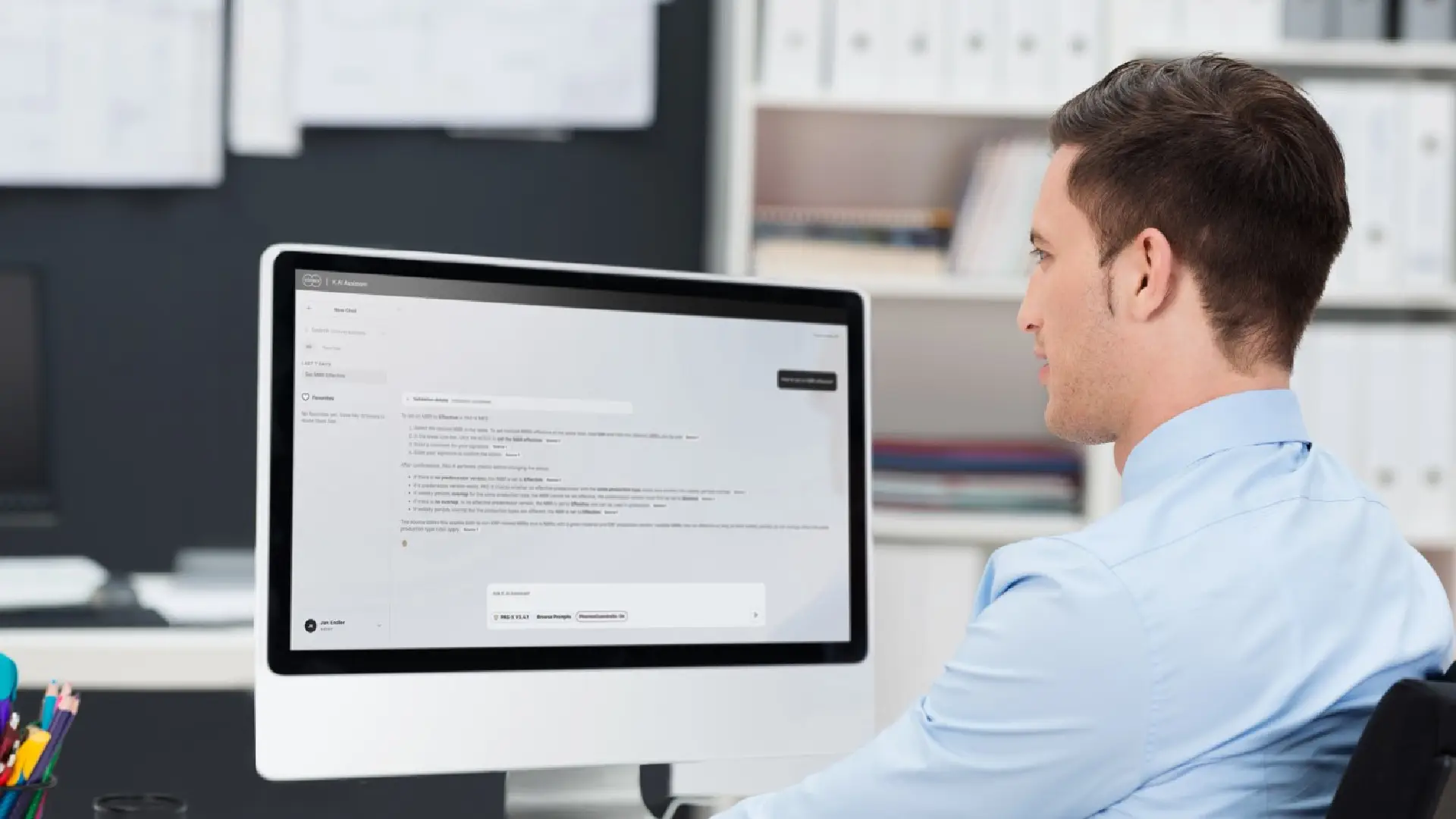 a Körber employee working on a computer