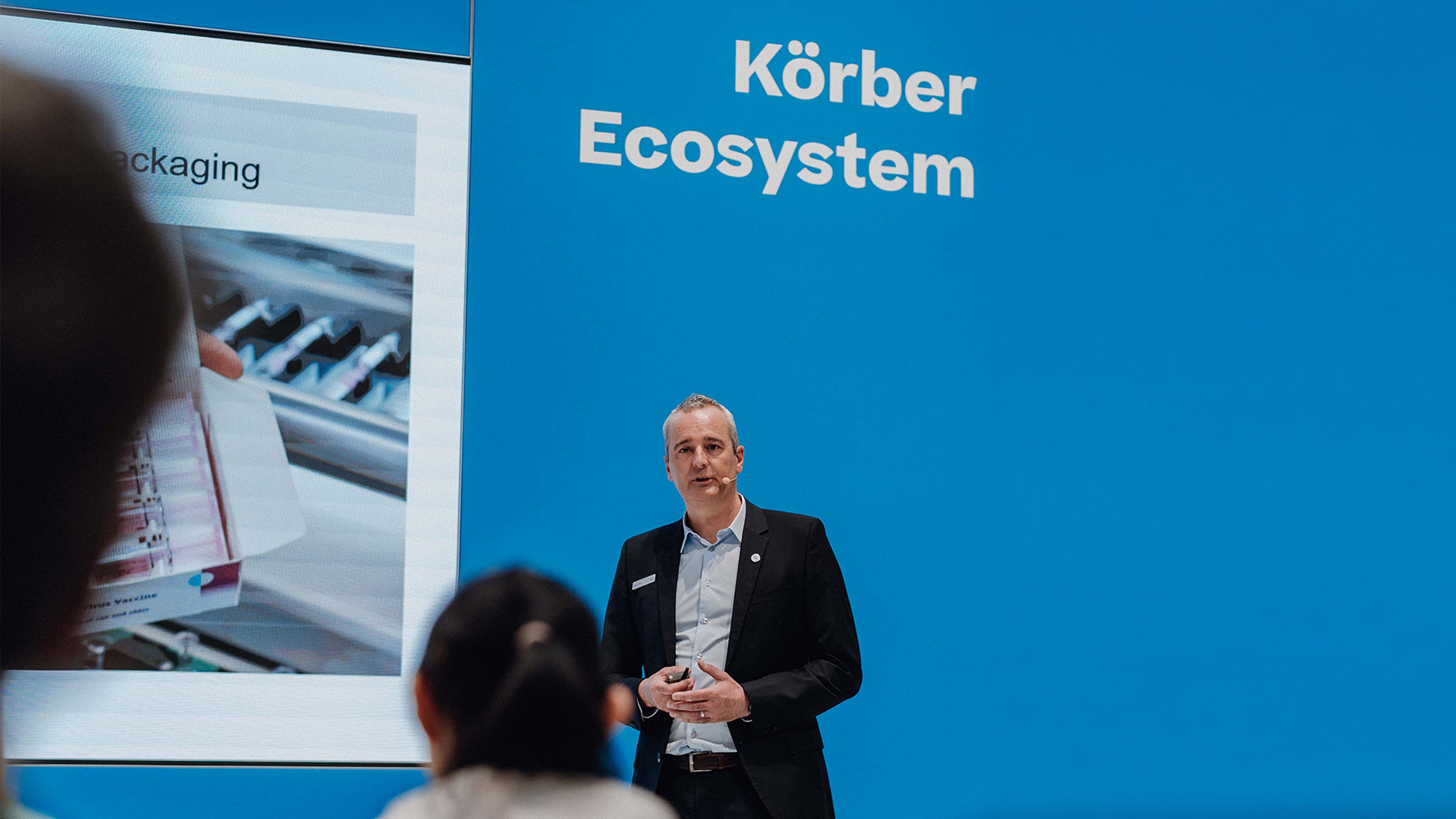 Man giving a presentation to a room of people