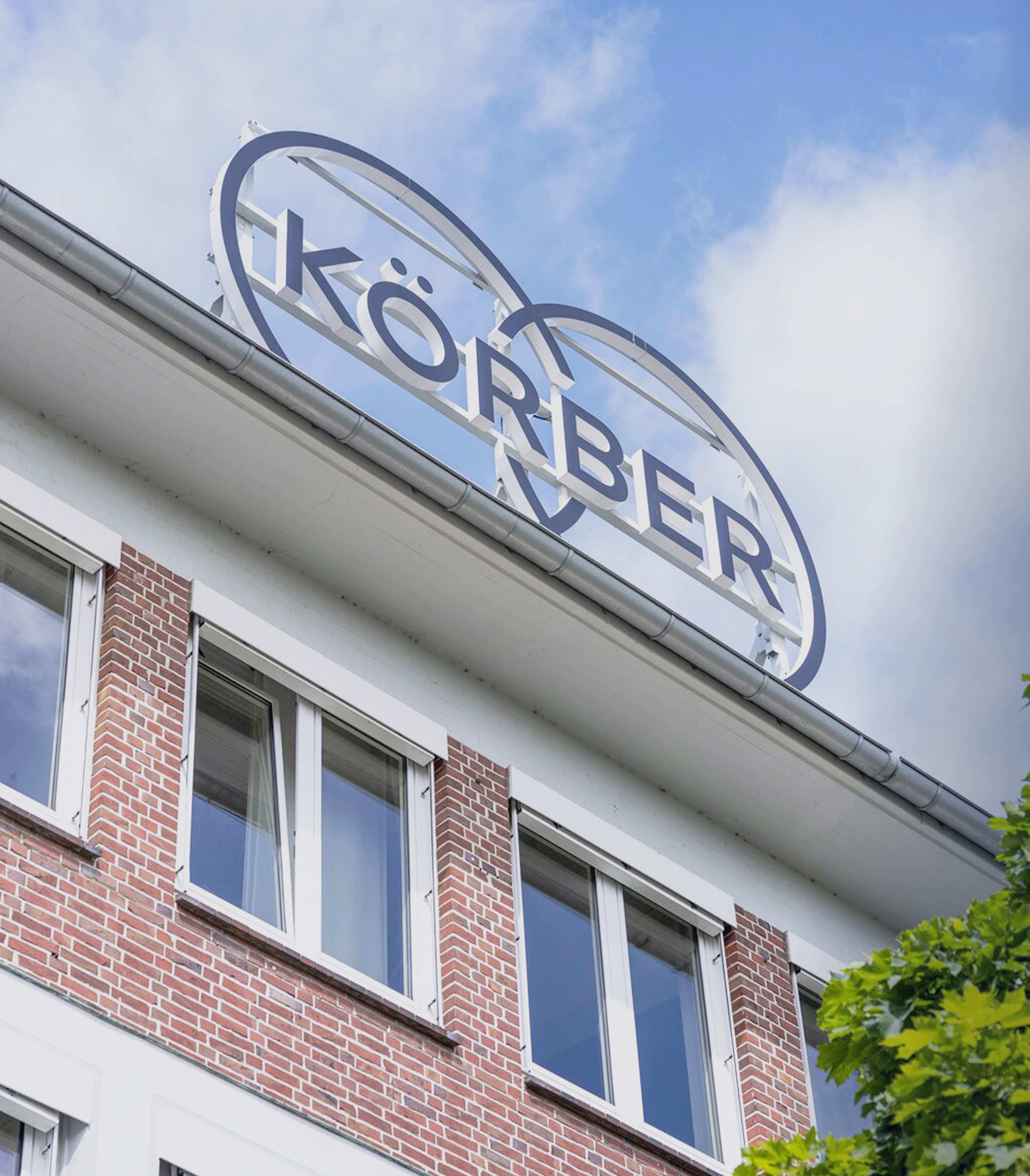 Körber logo on top of a brick building