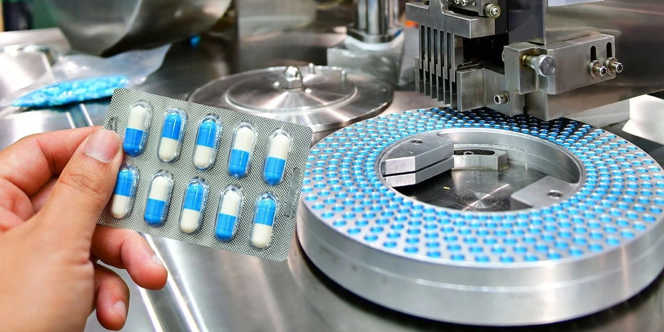 Picture of a package of pills and the machine producing it.